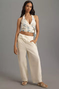 Load image into Gallery viewer, Pilcro Halter Buckle Wrap Top
