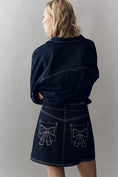 Load image into Gallery viewer, Pilcro Denim Bow Mini Skirt
