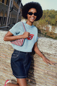 Load image into Gallery viewer, Pilcro Denim Bow Mini Skirt
